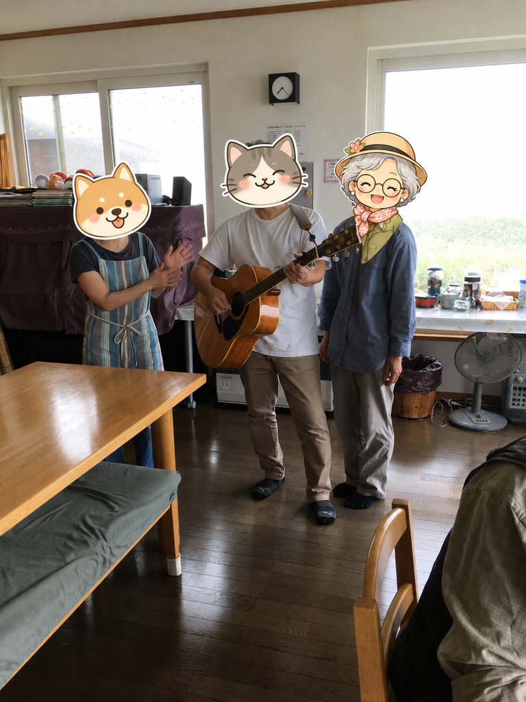 星観荘の広間でご主人がギターを演奏し、誕生日を祝ってくれた場面